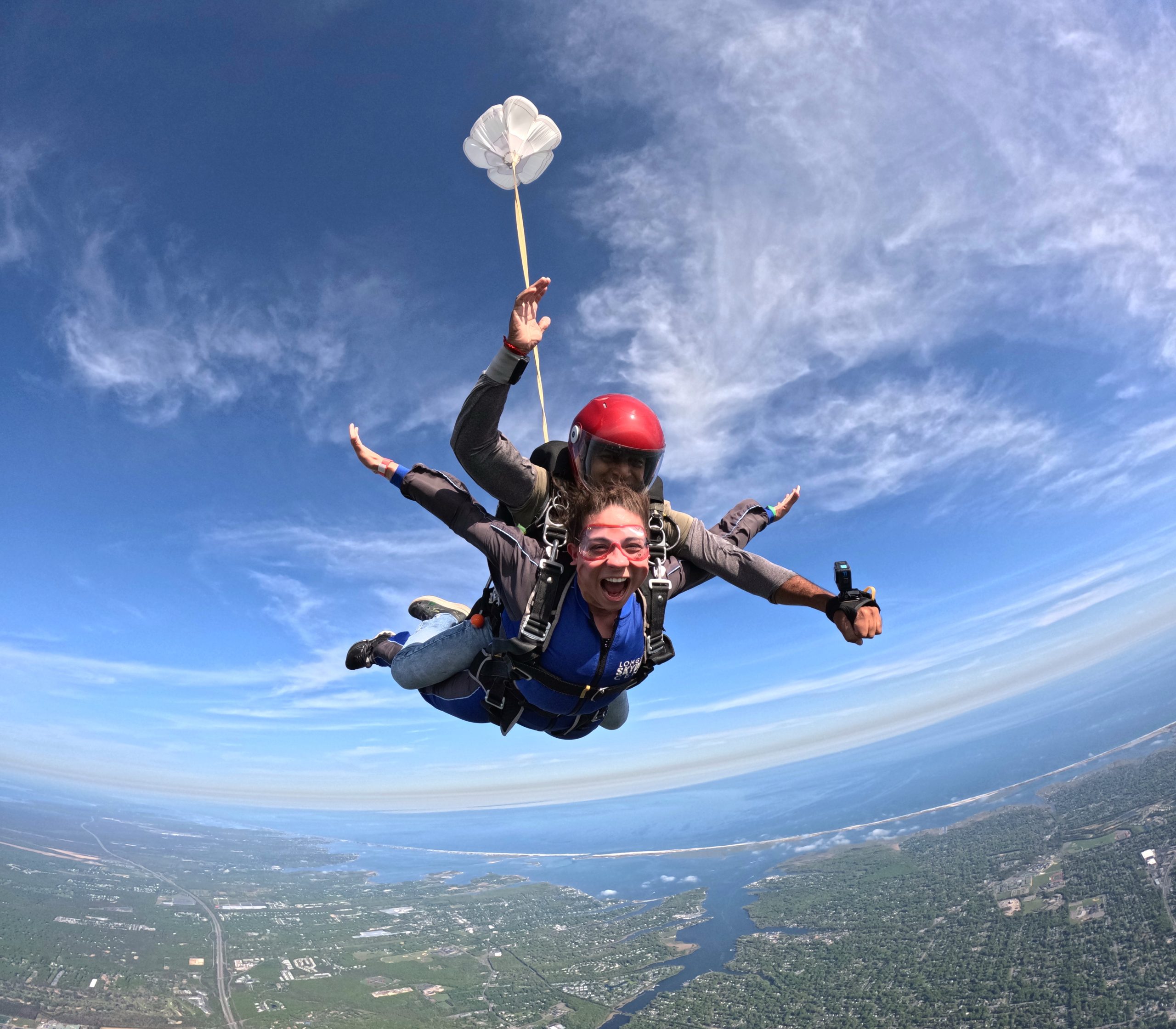 Woman smiling during tandem skydiving